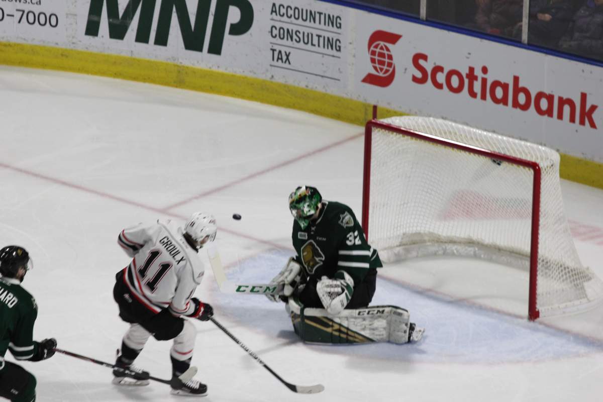 Joseph Raaymakers of the London Knights denies Daylon Groulx of the Owen Sound Attack on a second period breakaway chance.