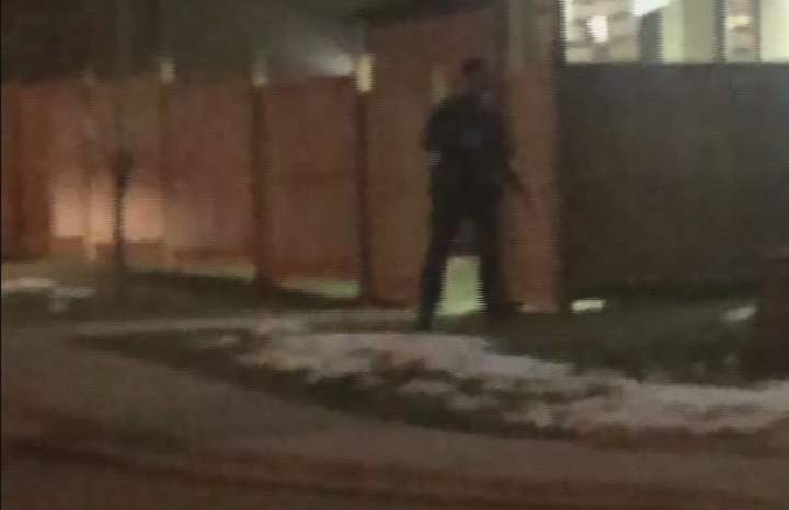 Police surround a home in Maple Ridge on Wednesday night. 