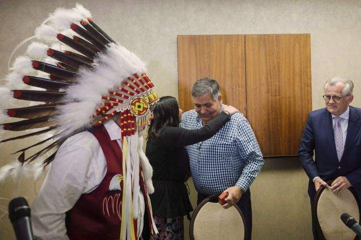 Chief Archie Waquan, left to right, former Chief Steve Courtoreille with Director of Government and Industry relations Melody Lepine, and lead counsel Robert Janes leave after holding a press conference to respond to the Supreme Court of Canada's decision on Courtoreille v. Canada in Edmonton, Alberta, on Thursday, Oct.11, 2018. 