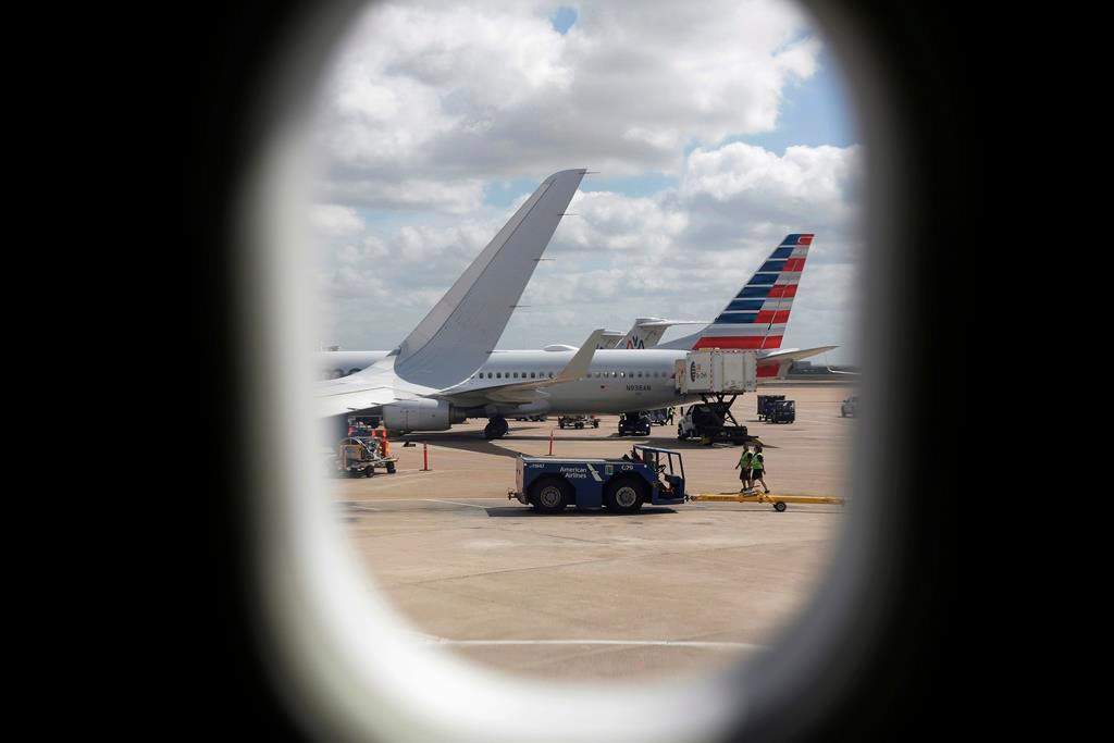 FILE- In this June 16, 2018, file photo, American Airlines aircrafts aircrafts are seen at O"Hare International Airport in Chicago.