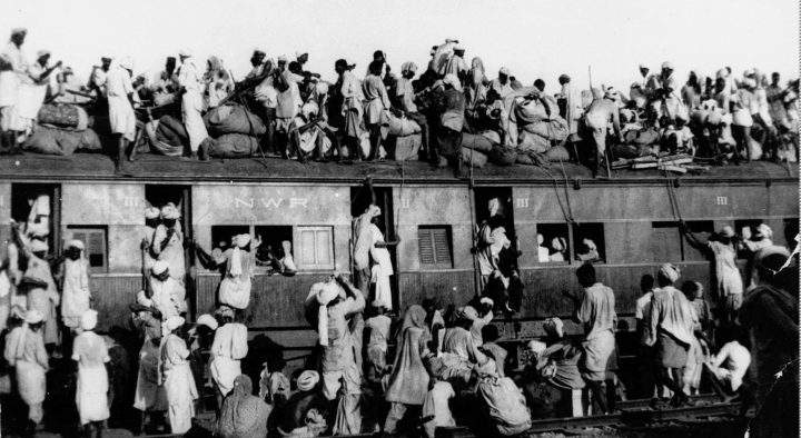In this September 1947, file photo hundreds of Muslim refugees crowd on top a train leaving New Delhi for Pakistan.