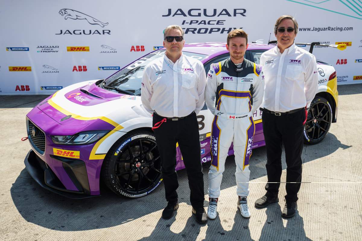 Edmonton’s Stefan Rzadzinski (centre) with team principals Keith Smouth and Mark Preston in front of their TECHEETAH Jaguar i-Pace race car. (Supplied by Stefan Rzadzinski via Jaguar Racing)
