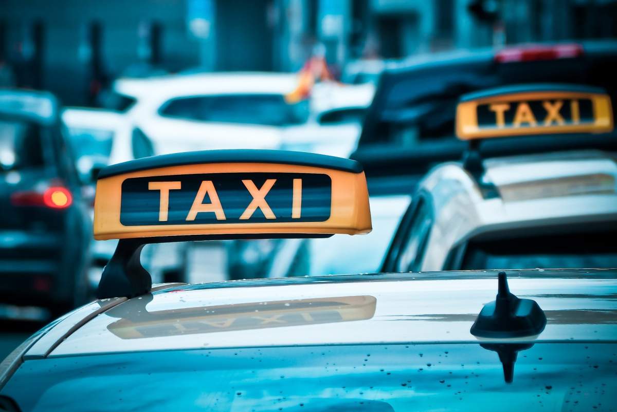 Taxi cabs on a street.