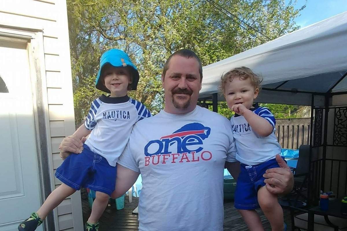 Tim Smuck, 39, poses with his two sons, Ace and Lincoln.