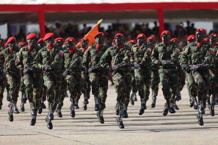 Soldiers, armed with Russian-made rifles, participate in a military act hours after Venezuelan President Nicolas Maduro was sworn again as president of the country, in Caracas, Venezuela, on Jan. 10, 2019.
