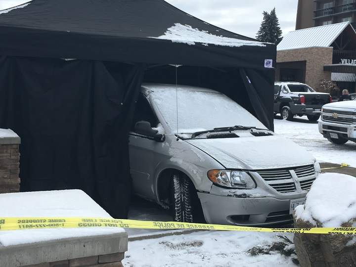 Vernon RCMP have placed a tent around a minivan.