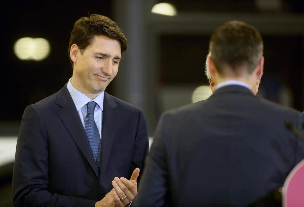 Winnipeg mayor Brian Bowman finishes speaking as Prime Minister Justin Trudeau looks on in this file photo.