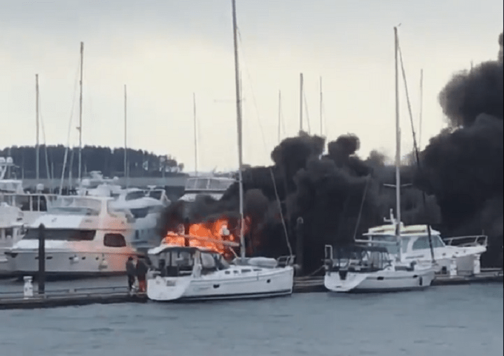 A yacht burns in the Port Sidney Marina on Saturday.