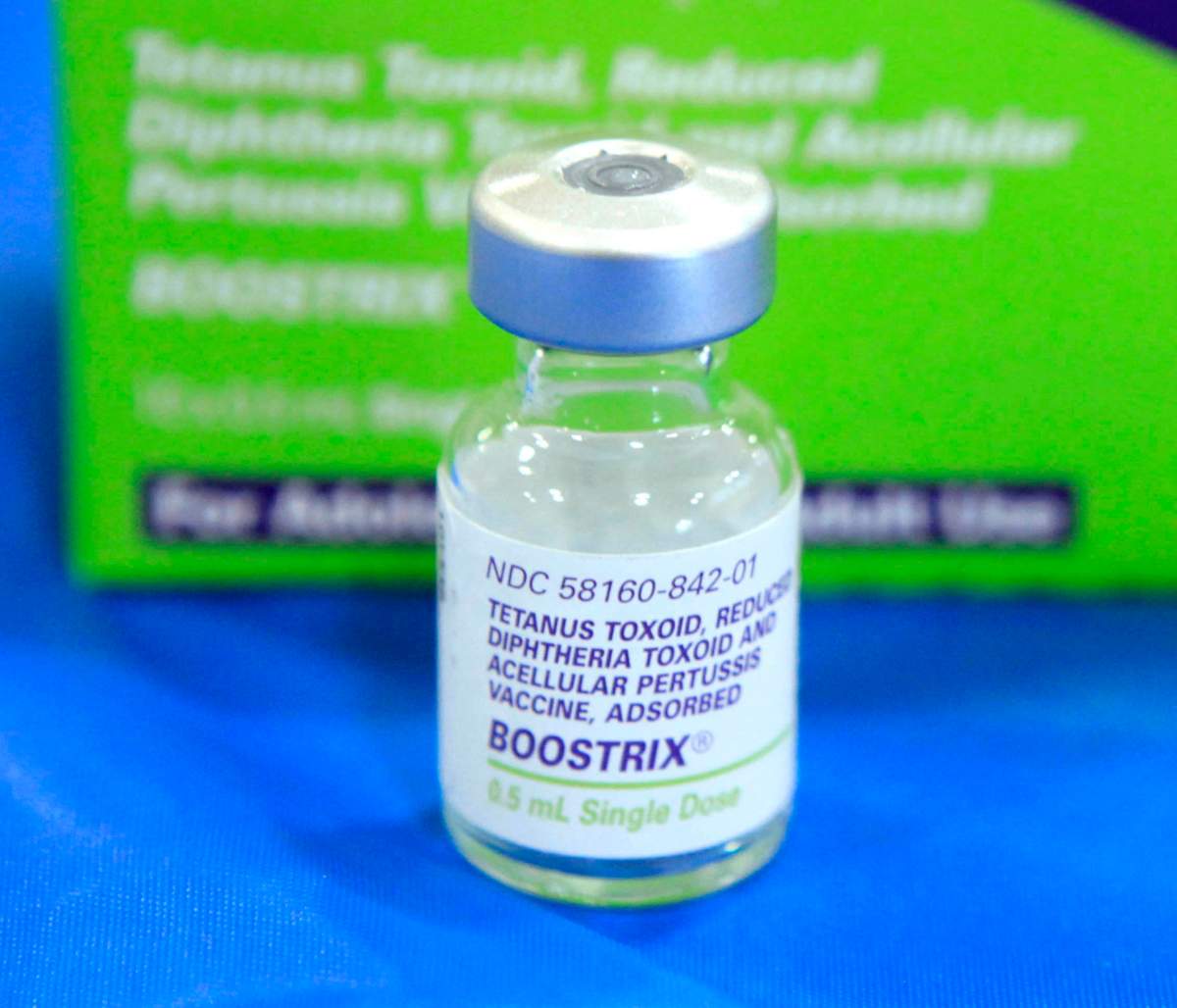 File photo shows an empty bottle of tetanus, diphtheria and pertussis, (whooping cough) vaccine.