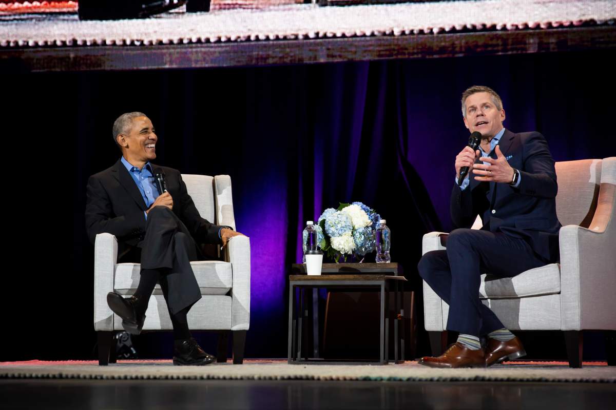 Barack Obama and Dave Kelly on stage in Calgary on March 5, 2019.