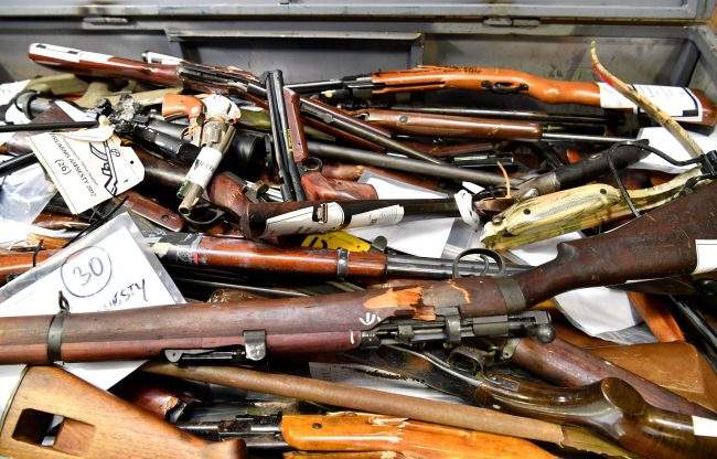 Confiscated firearms are put on display for the media in Brisbane, Queensland, Australia, 12 October 2017.