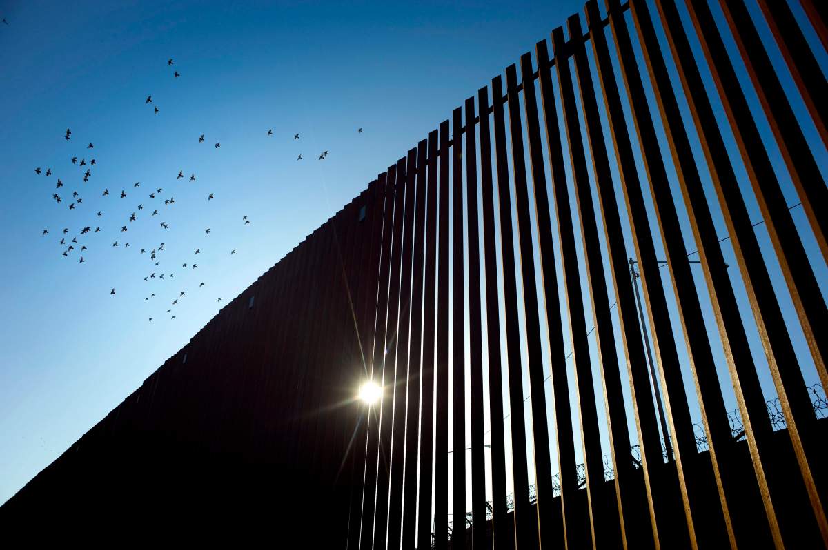 Birds fly over a section of the recently renovated US-Mexico border wall, in Calexico, California, USA, on 26 October 2018.