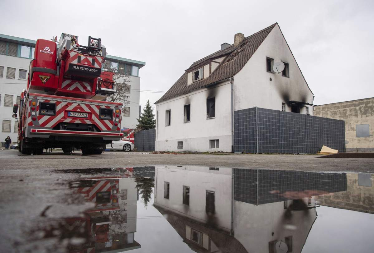 A fire truck stands in front of a house damaged by a fire in Nuremberg, Germany, March 2, 2019. Four children an a woman were killed by the fire.