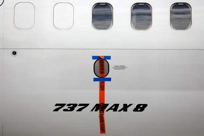 FILE PHOTO: A seal is seen on Garuda Indonesia's Boeing 737 Max 8 airplane parked at the Garuda Maintenance Facility AeroAsia, at Soekarno-Hatta International airport near Jakarta, Indonesia, March 13, 2019. REUTERS/Willy Kurniawan/File Photo.