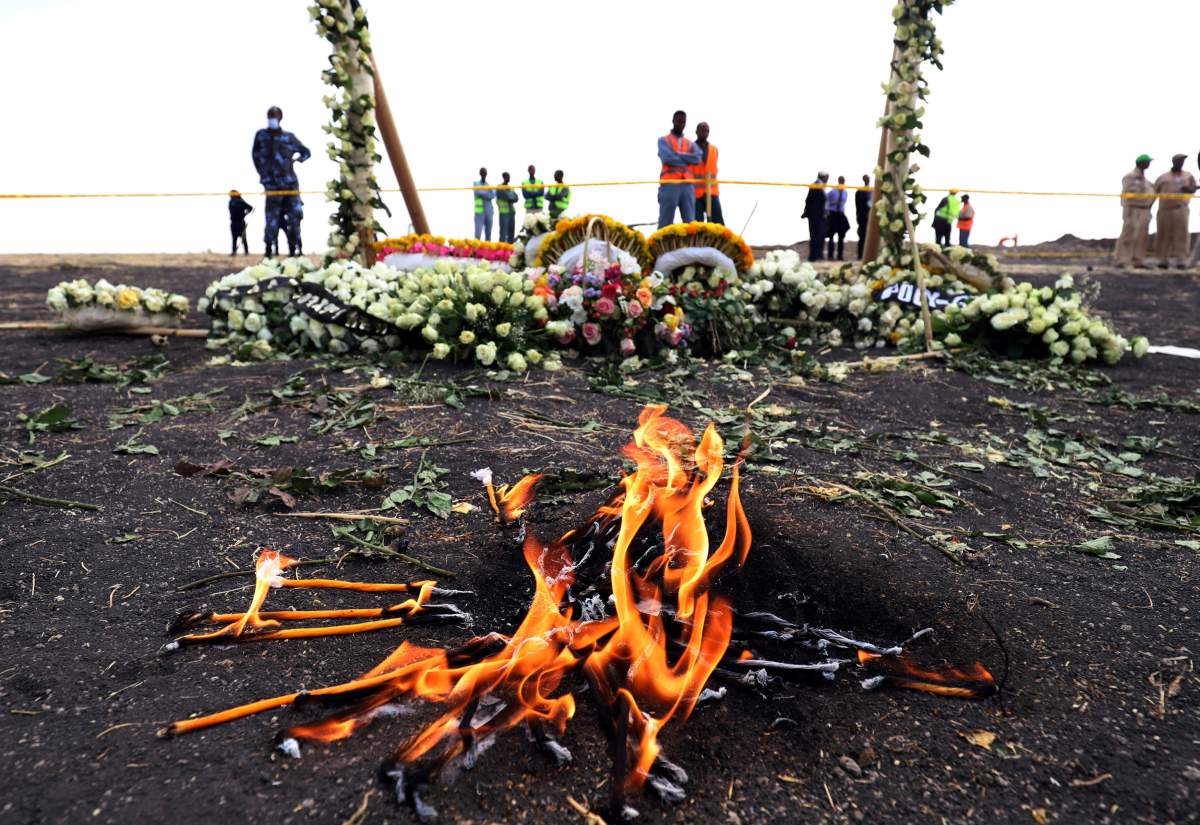 Candle flames burn during a commemoration ceremony for the victims at the scene of the Ethiopian Airlines Flight ET 302 plane crash, near the town Bishoftu, near Addis Ababa, Ethiopia March 14, 2019.