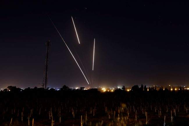 Streaks of light are pictured as rockets are launched from the Gaza Strip towards Israel, March 25, 2019.