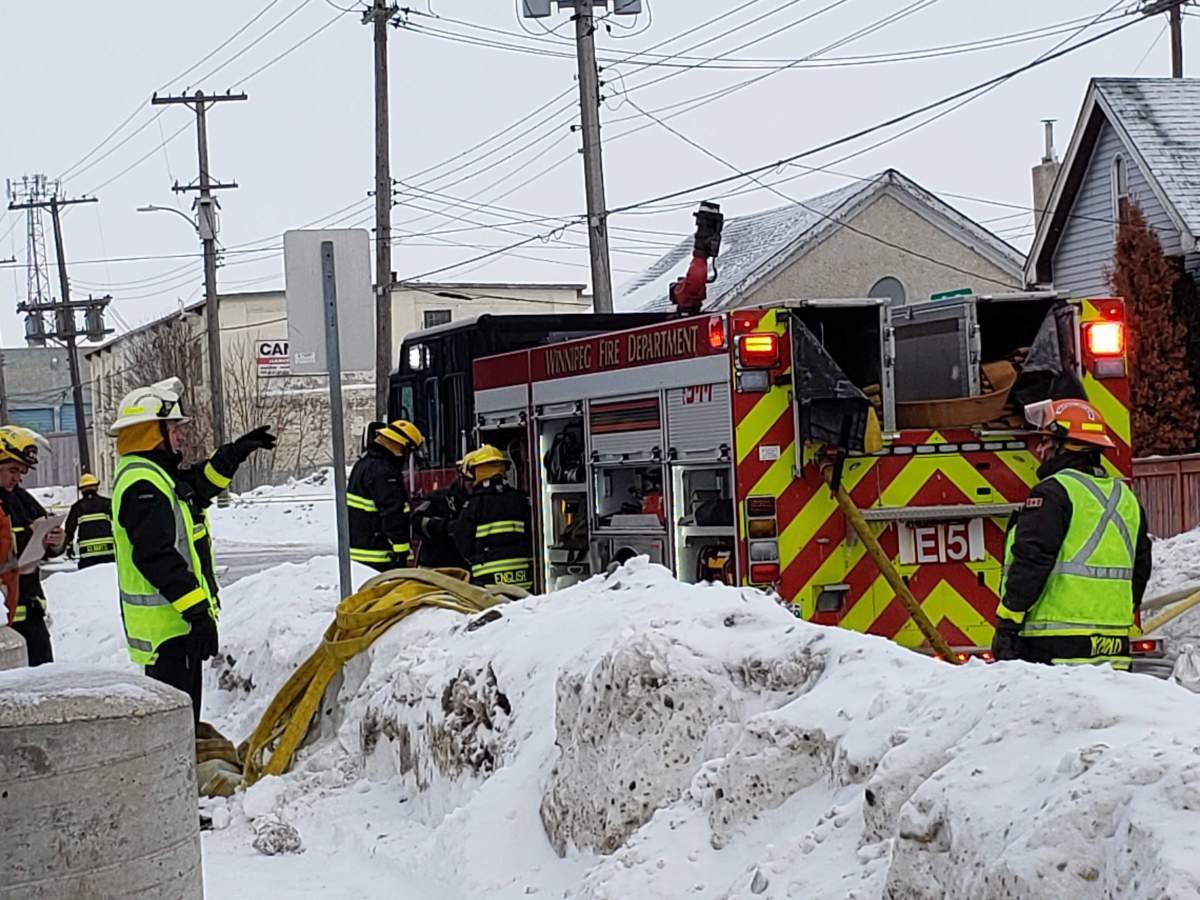 Winnipeg crews are seen working to fight flames.