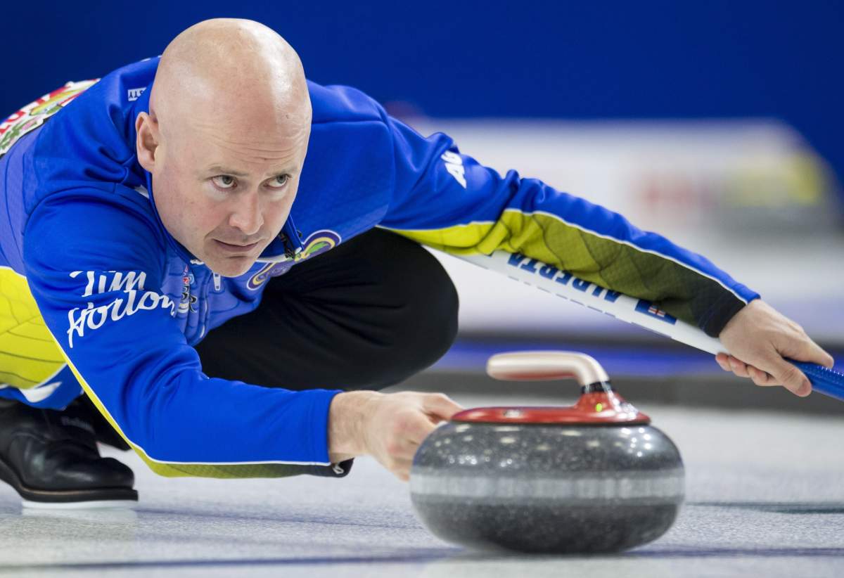 Team Alberta skip Kevin Koe makes a shot during the 16th draw against team wild-card at the Brier in Brandon, Man., Thursday, March, 7, 2019. 