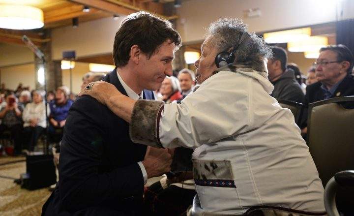 Prime Minister Justin Trudeau is greeted by an Inuit Elder prior to delivering an official apology to Inuit for the federal government’s management of tuberculosis in the Arctic from the 1940s to the 1960s during an event in Iqaluit, Nunavut on Friday, March 8, 2019.