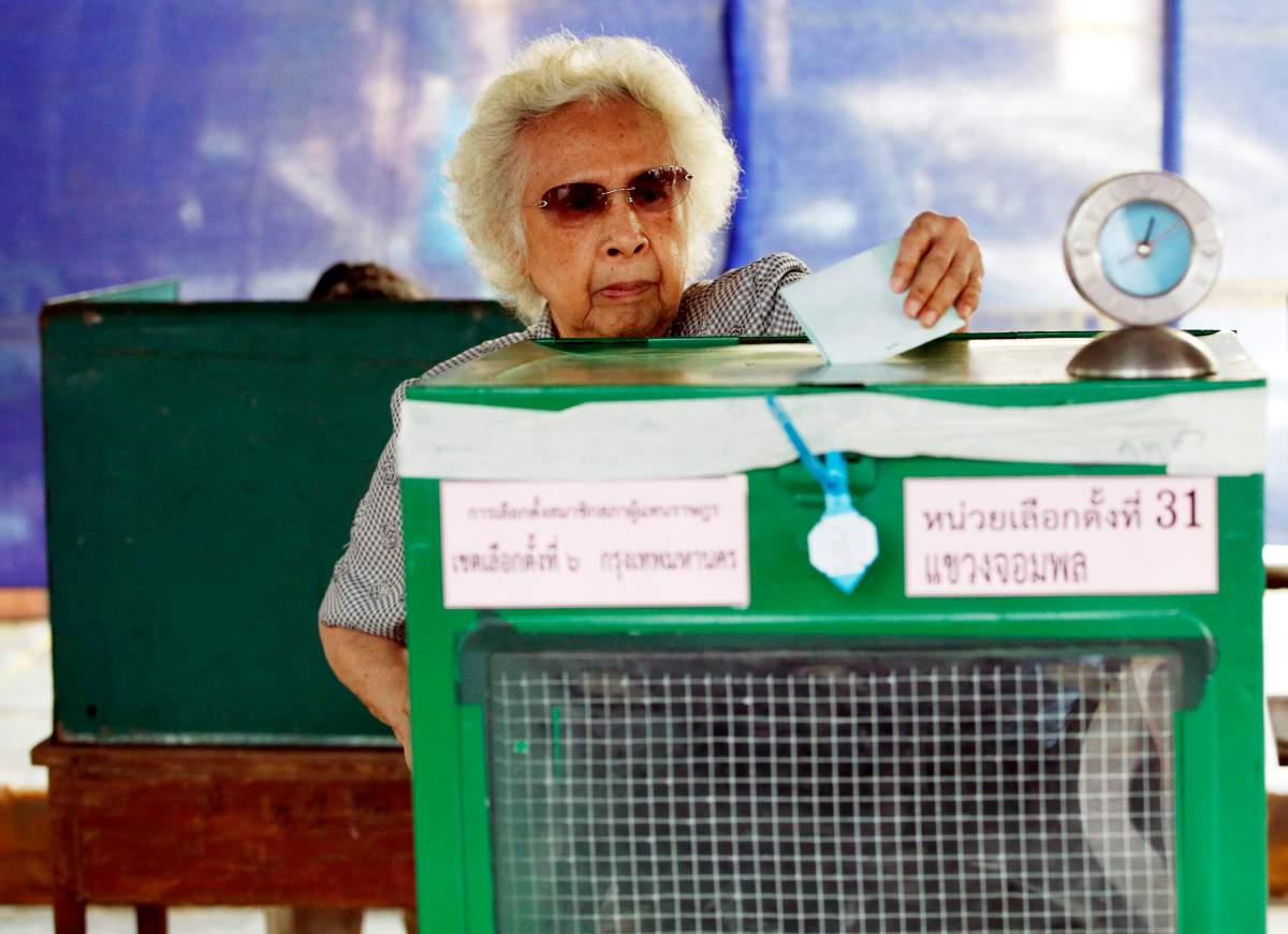 A Thai woman casts her ballot during the general election at a polling station in Bangkok, Thailand, 24 March 2019. 