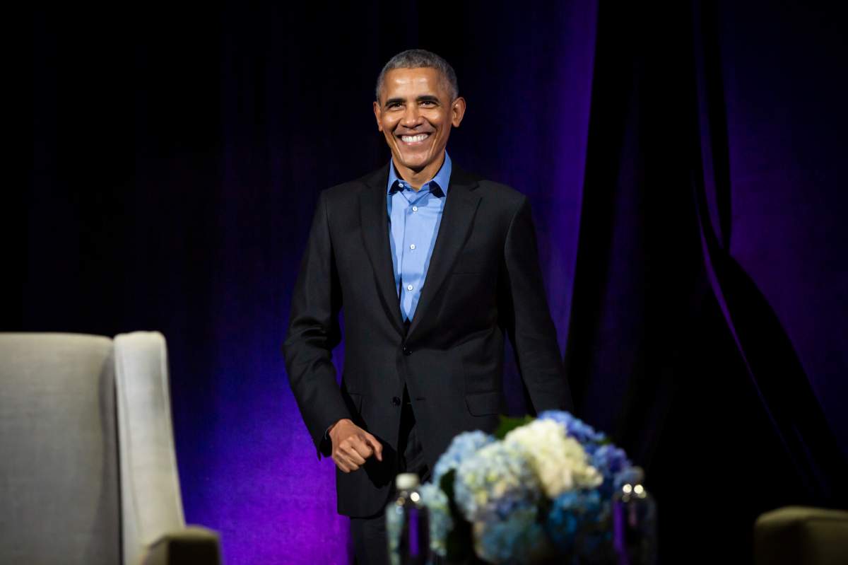 Former U.S. president Barack Obama walks on stage in Calgary on March 5, 2019.