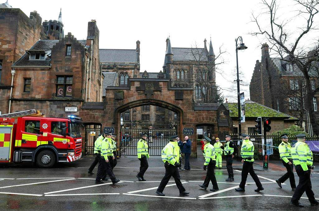 Police and fire services outside the University of Glasgow after the building was evacuated when a suspect package was found in the mailroom, in Glasgow, Scotland, Wednesday March 6, 2019.