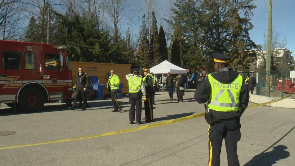 Police and firefighters mass outside the Anita Place homeless camp on Feb. 24 as the city enforced its injunction.