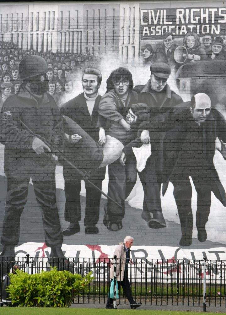This file photo shows a man walking past a Bloody Sunday mural in the Bogside, Londonderry, Northern Ireland, on June 15, 2010.