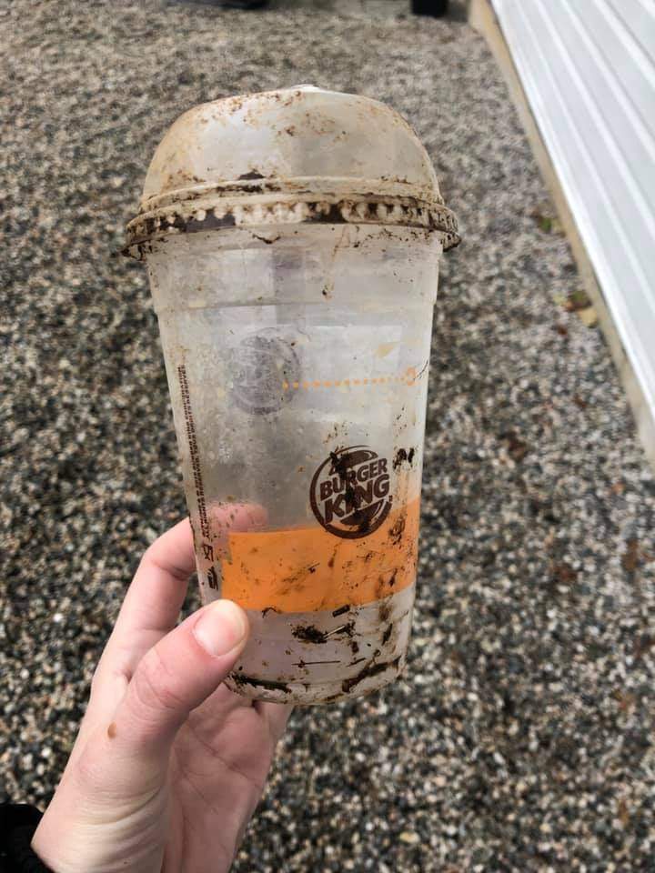 The cup Krasuin pulled from the skunk’s head. She said she was surprised at how firmly the lid was clamped onto the cup.