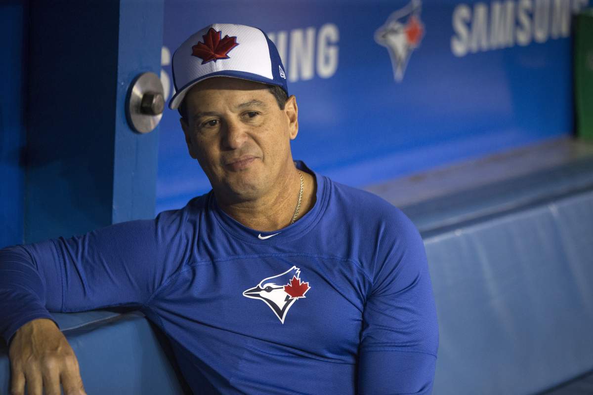 Toronto Blue Jays manager Charlie Montoyo is pictured in the dugout following an on-field session in Toronto on Wednesday, March 27, 2019, ahead of Thursday's season-opening game.