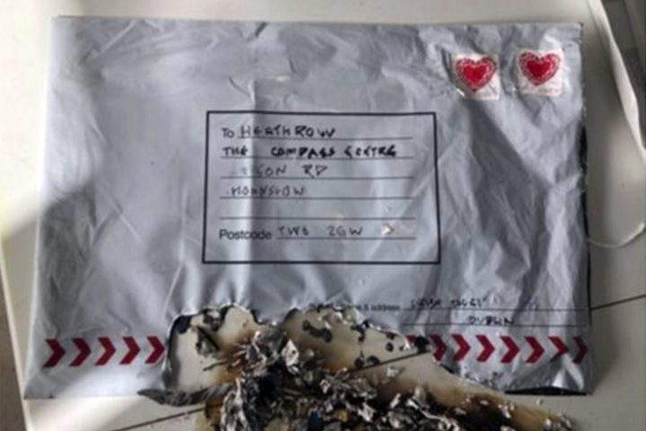 In this handout photo provided by Sky News, a suspect package that was sent to Heathrow airport and caught fire is seen in England, Tuesday, March 5, 2019.