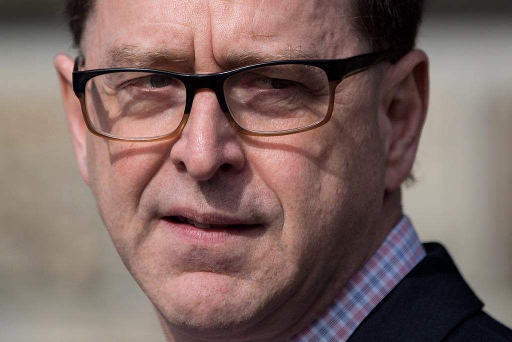 British Columbia Health Minister Adrian Dix pauses while speaking at Woodlands Memorial Garden in New Westminster, B.C., on Saturday March 31, 2018.