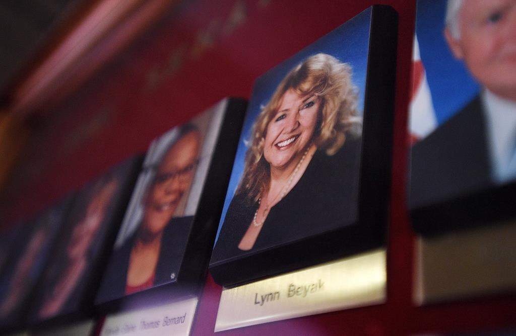 A picture of Senator Lynn Beyak accompanies other Senators official portraits on a display outside the Senate on Parliament Hill in Ottawa on Thursday, Sept. 21, 2017. The Senate's ethics officer says Sen. Lynn Beyak violated the upper chamber's conflict of interest code by posting racist letters about Indigenous Canadians on her website. THE CANADIAN PRESS/Sean Kilpatrick.