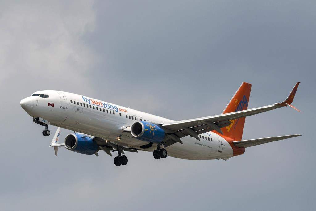 A Sunwing Boeing 737-800 passenger plane prepares to land at Pearson International Airport in Toronto on Wednesday, August 2, 2017.