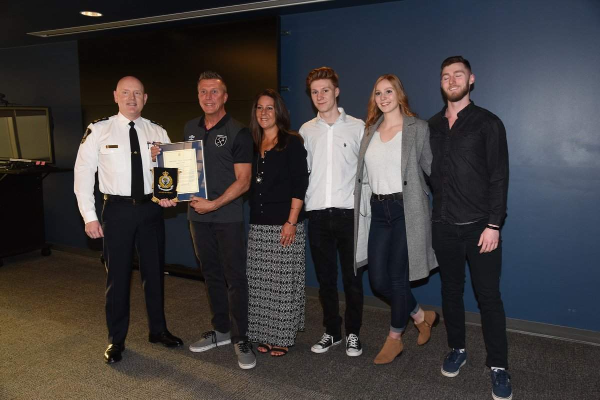Karl Dey received the Award of Merit for helping police capture the suspects in two crimes.