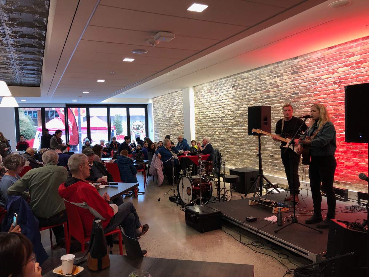 Music fans duck out of the rain for a Fanshawe Live performance inside the college’s downtown campus on Dundas Place.