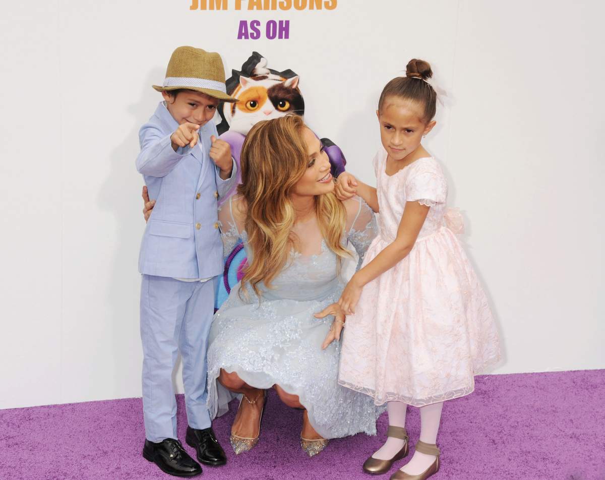 Actress/singer Jennifer Lopez (C) and children Emme and Maximilian arrive at the ‘HOME’ Los Angeles Premiere at Regency Village Theatre on March 22, 2015, in Westwood, California. (Photo by Jeffrey Mayer/WireImage)