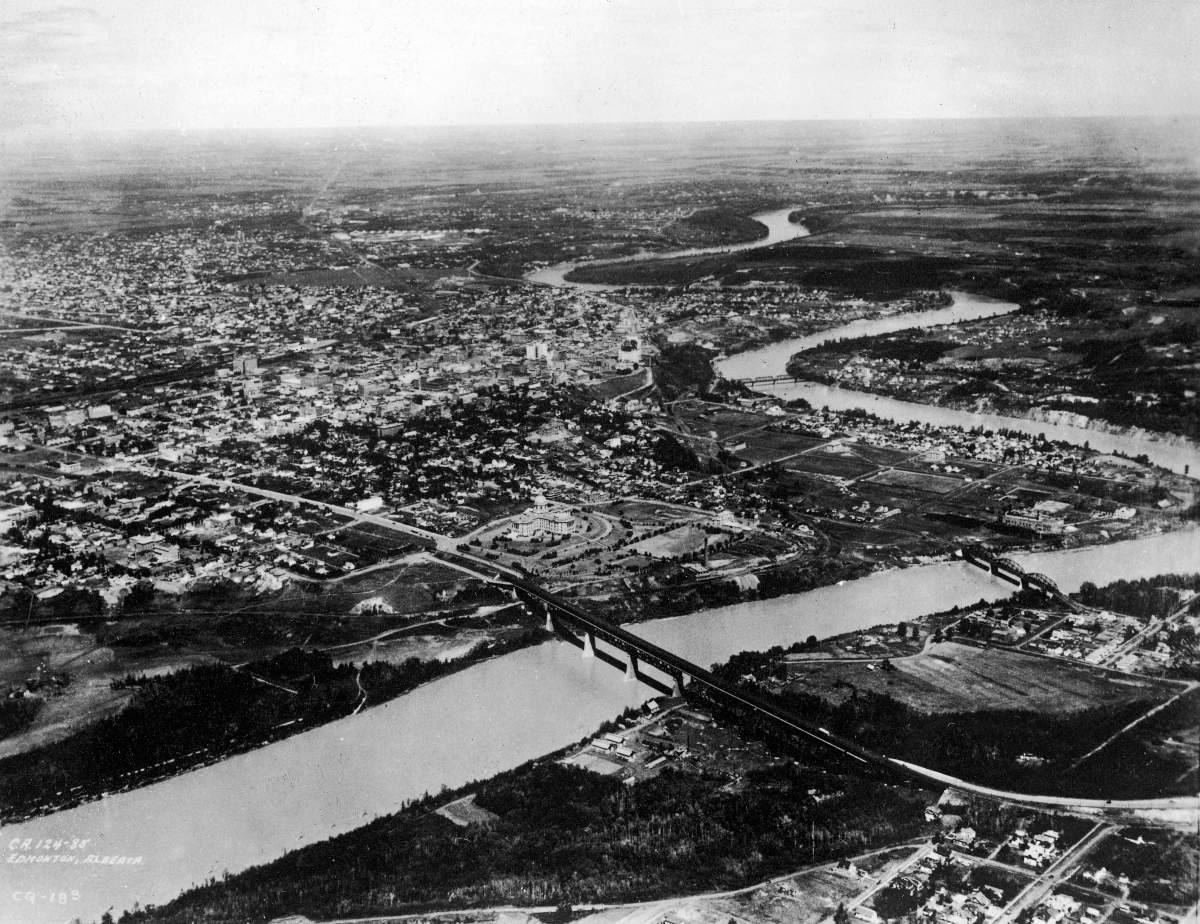 Aerial view of Edmonton and the North Saskatchewan River, Edmonton, Alberta, Canada, early 1930s. The Alberta Legislature Building can be seen in the center.
