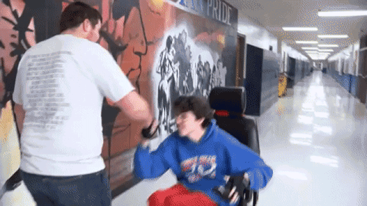 Tanner Wilson (L) and Brandon Qualls (R) embrace in a hallway at Caddo Hills High School in Arkansas.