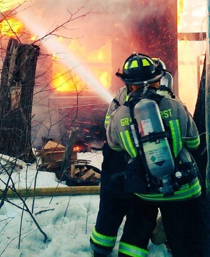 By the time fire crews arrived on scene, the fire had already broken through the roof.