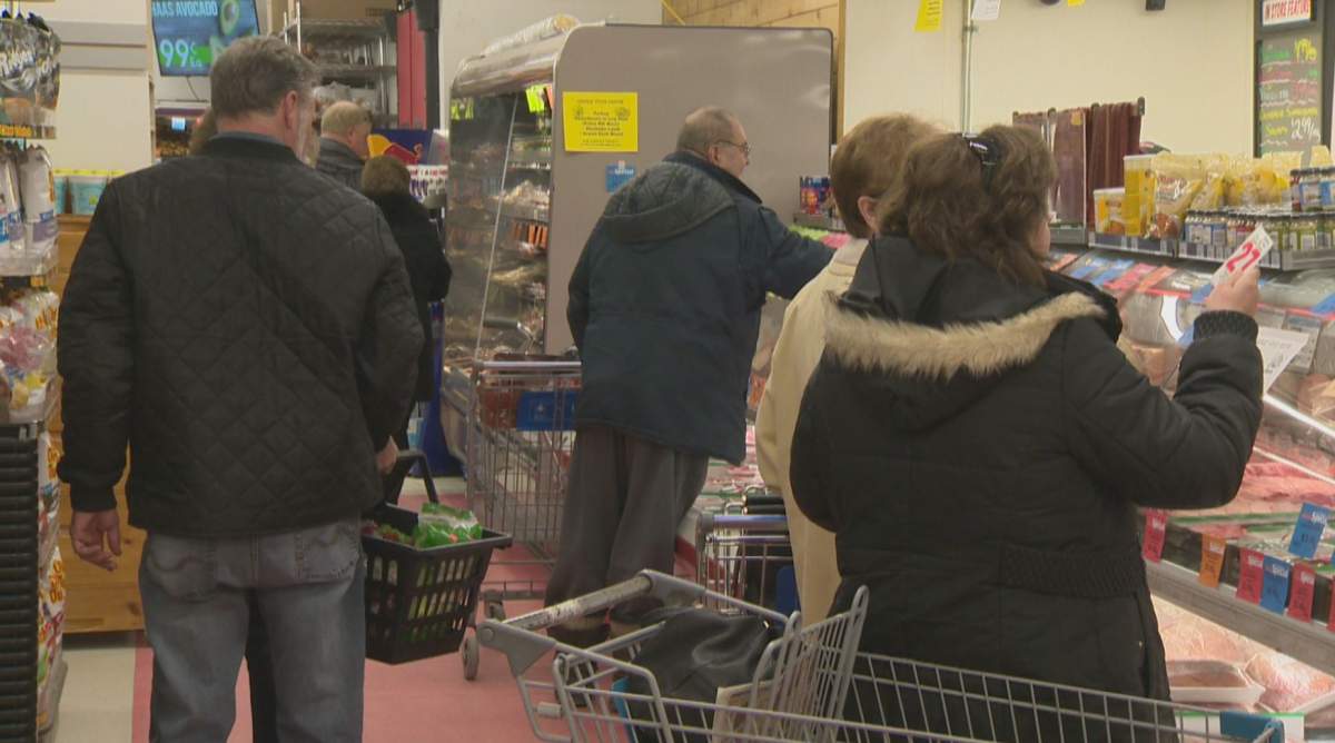 Customers at the deli at Food Fare’s Portage Avenue location.