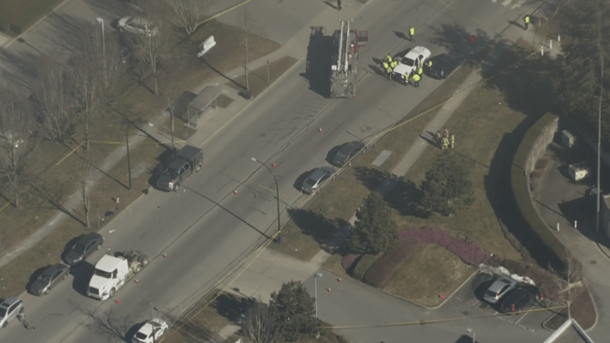 A heavy police presence remains on scene at North Fraser Way and Glenlyon Parkway in Burnaby.