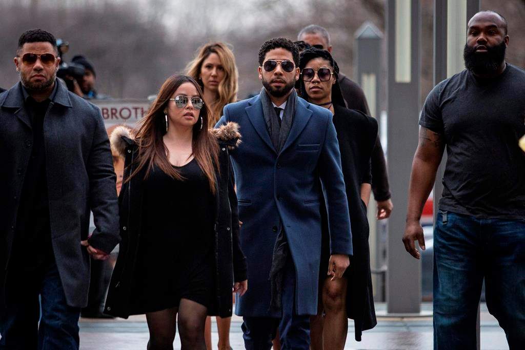 'Empire' actor Jussie Smollett, center, arrives at the Leighton Criminal Court Building for his hearing on Thursday, March 14, 2019, in Chicago.