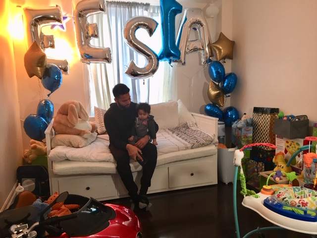 Ahmad with his son Eesa in 2019. Photo by Global News.