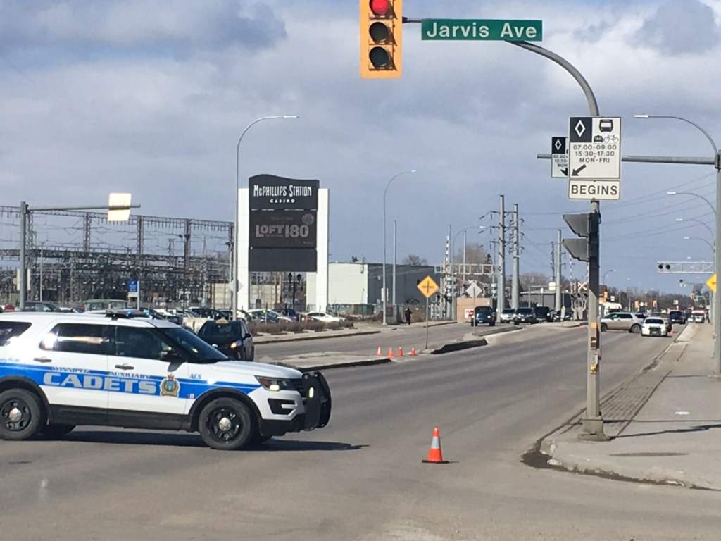 A cadet vehicle blocks off the street after an accident involving a vehicle and pedestrian.