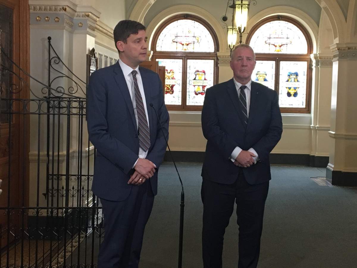 B.C. Attorney General David Eby and Minister of Border Security and Organized Crime Reduction Bill Blair speak to reporters in Victoria on March 27, 2019.