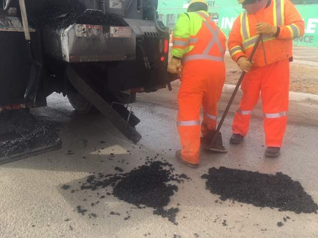 City crews working on filling potholes at Saskatchewan Avenue and Berry Street.
