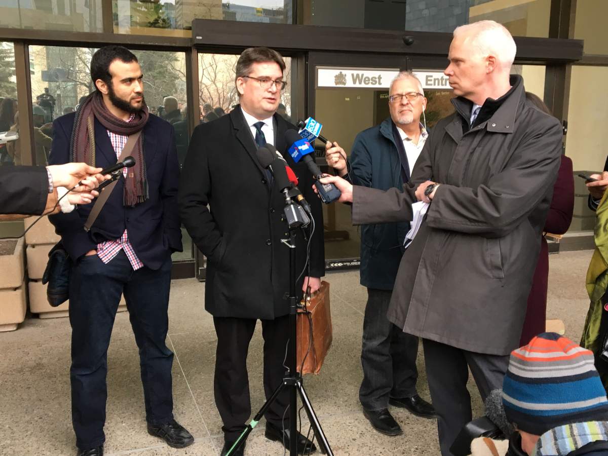 Omar Khadr and his lawyer Nathan Whitling outside an Edmonton court Monday, March 25, 2019.