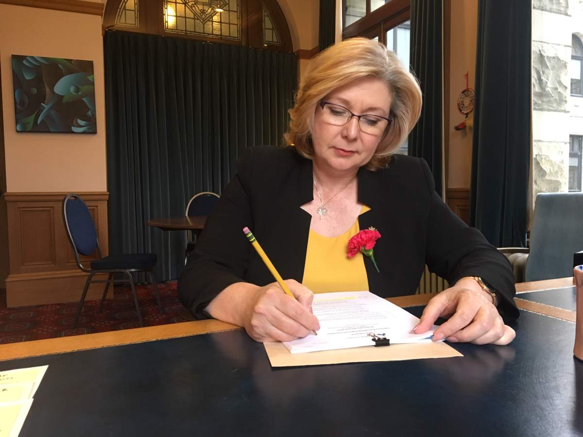 Mary Polak is proposing new rules that would waive fees to hyphenate names.