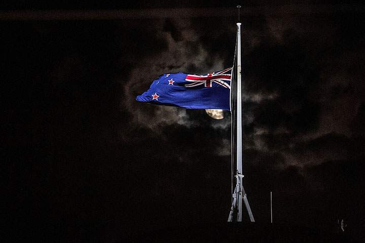 The New Zealand national flag is flown at half-mast on a Parliament building in Wellington on March 15, 2019, after a shooting attack in Christchurch.